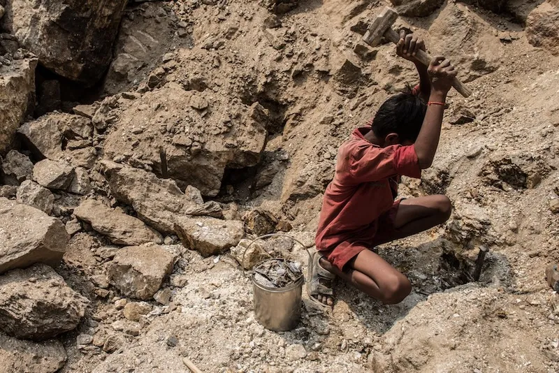a boy mining mica