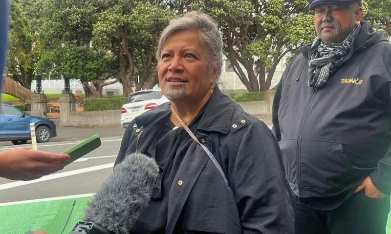 Mariameno stands outside the high court speaking to reporters.