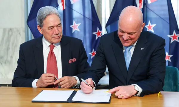 Winston Peters and Christopher Luxon, pictured signing a deal on which they were more aligned, the 2023 coalition agreement. (Photo by Hagen Hopkins/Getty Images)