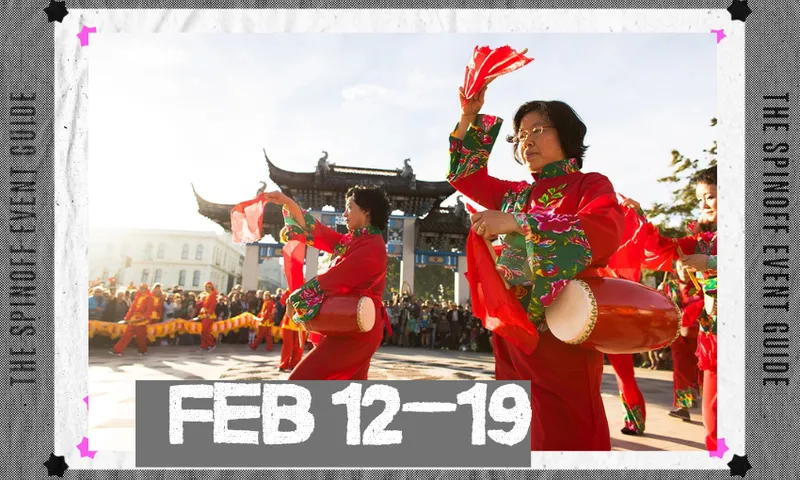 Two Chinese woman are dancing outside with a traditional Chinese building in the background.