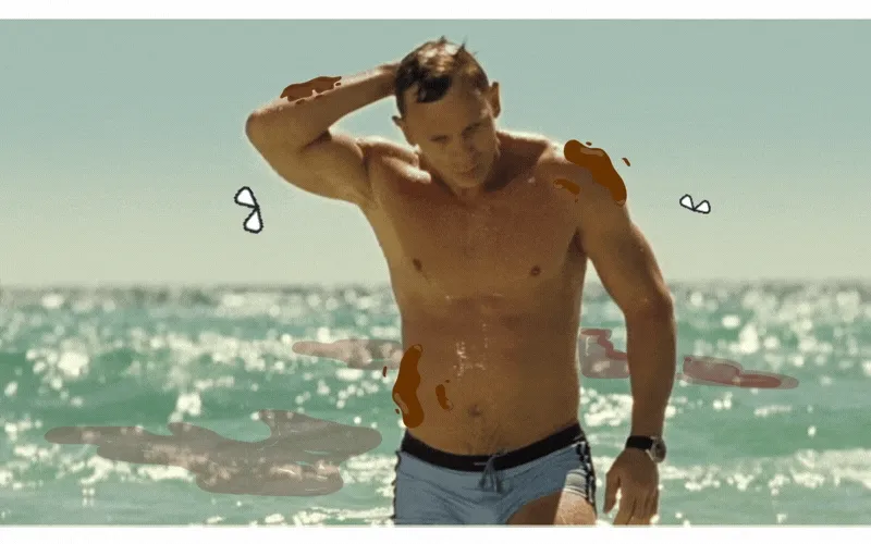 A muscular man in blue swim trunks emerges from the ocean, touching the back of his head. Brown stains and cartoon flies are drawn on his body and the water, suggesting a humorous or messy situation.