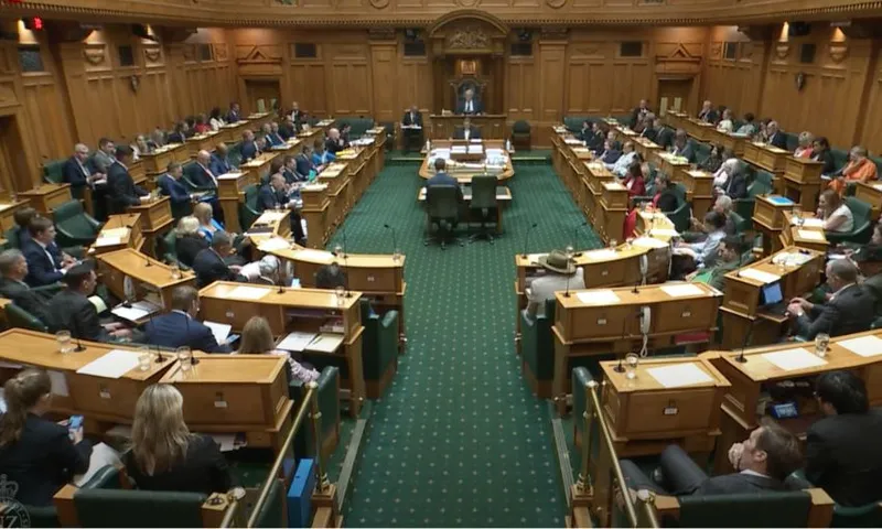 A wide view of the House, showing parliamentarians at their benches.