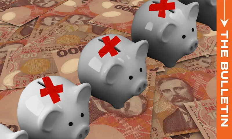 Three gray piggy banks with red tape Xs on them are lined up on top of a pile of New Zealand banknotes. An orange sidebar on the right displays the text “THE BULLETIN.”.