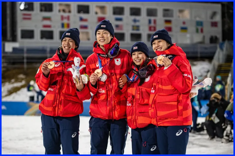 Team Japan members wearing their red puffer jackets.