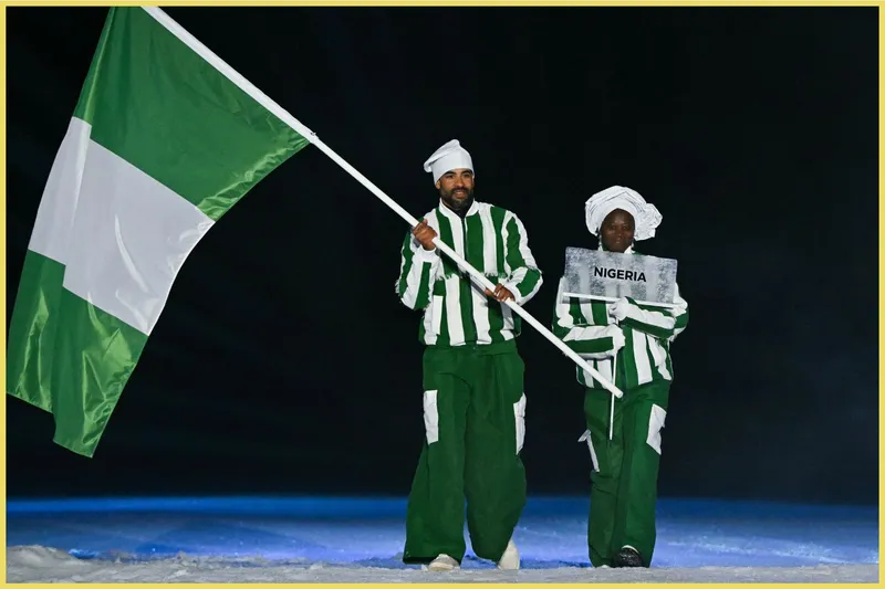 Nigeria's flag bearer Samuel Uduigowme at the Opening Ceremony