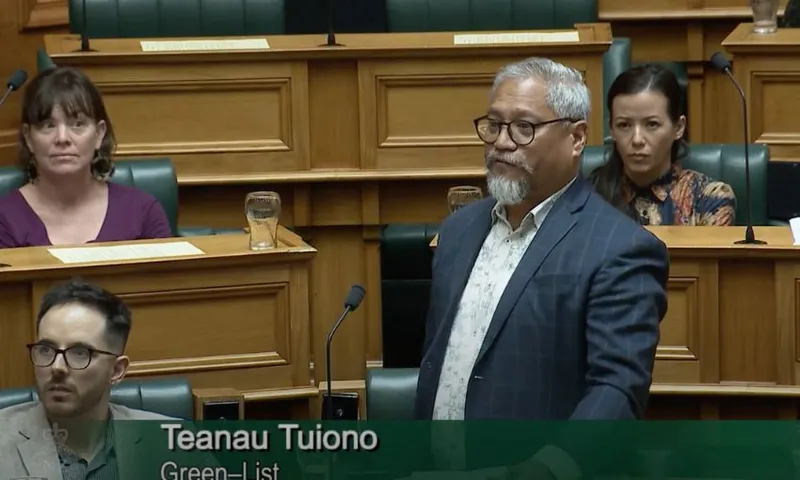 Teanau Tuiono faces the speaker as he stands at his bench.