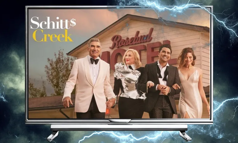 The promotional image for the TV show Schitt's Creek showing the four family members all dressed up outside their motel. The image is inside a TV frame and the background is stormy weather.