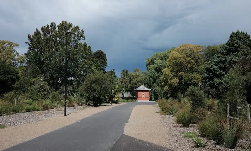 a road leading too a small brick pumphouse by the Avon river