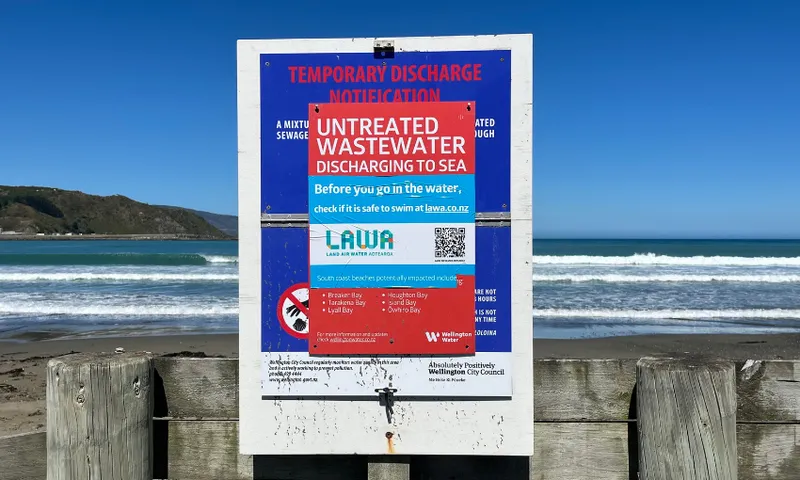 A sign on Lyall Bay encouraging locals to check LAWA before swimming.