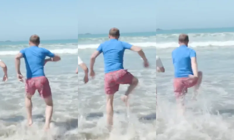 Screen grabs from RNZ of Andrew Little running into Lyall Bay, lifting his gangly legs high.