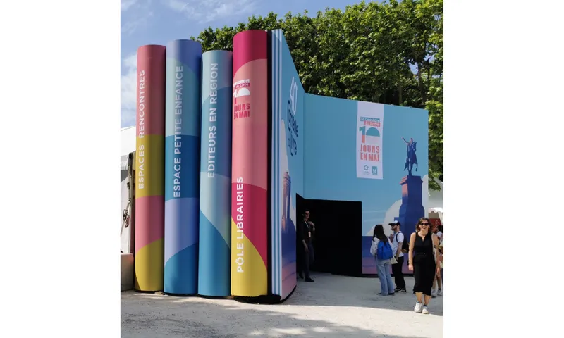A photo of a large entranceway modelled to look like a stack of books, with one open so you walk through it.