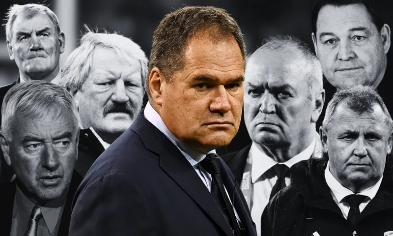 A serious-looking man in a suit is in the foreground, with seven other men in suits and coats behind him, all with stern or neutral expressions. The background is black and white; the foreground man is shown in color.
