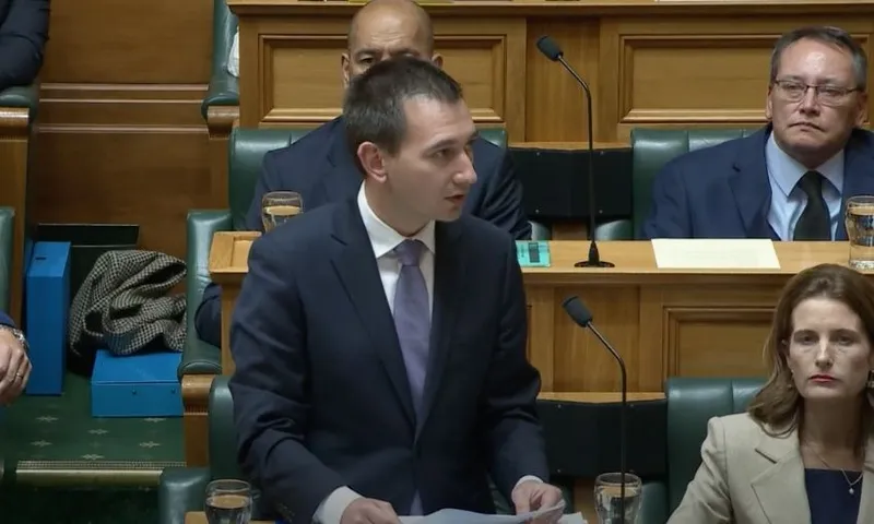 Simeon Brown looks towards the Speaker's chair as he speaks in parliament's debating chamber.