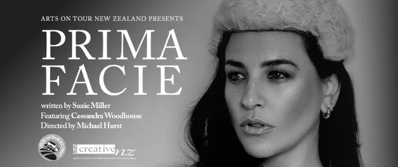 A black and white promotional banner for Prima Facie which shows a woman's face wearing a layer's wig.