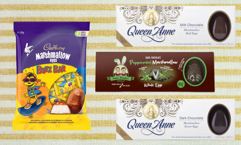 A selection of marshmallow Easter egg products, including a Cadbury Marshmallow Buzz Bar bag, a blue package with cartoon graphics, and three Queen Anne egg boxes in milk and dark chocolate varieties, on a patterned background.
