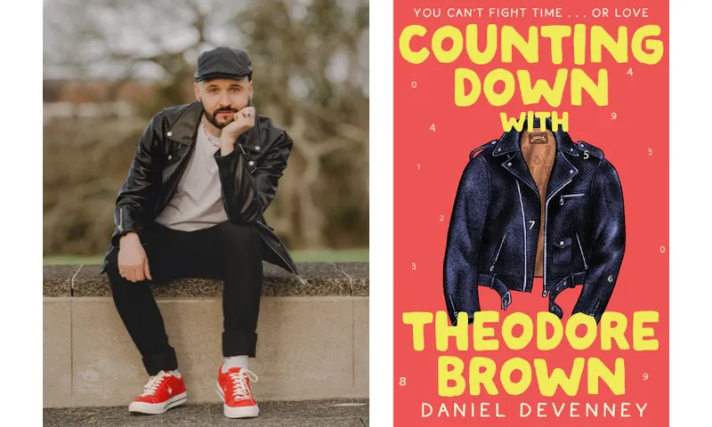 A photo of a young man sitting on a concrete wall. He's wearing a leather jacket and bright red shoes. Beside him is the cover of his book which has a red background, yellow lettering and an illustration of a leather jacket.