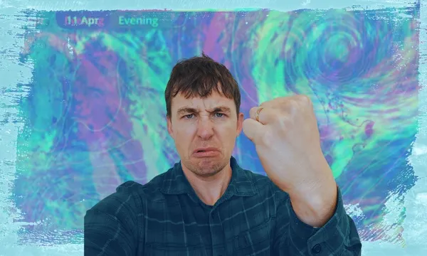 A man in a plaid shirt makes a serious face and gestures with a raised fist in front of a colorful, abstract, swirling background with text reading "11 Apr Evening" at the top left.