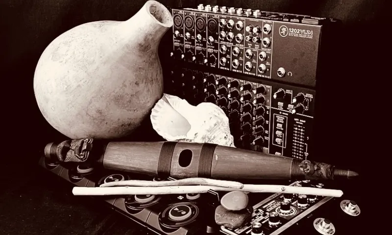 A monochrome image of taonga puoro arranged with an electronic mixer