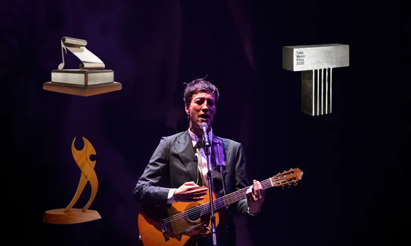 A music (Marlon Williams) performs in a suit and with a guitar. Overlaid are various music award trophies in New Zealand