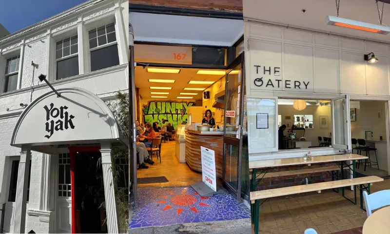 Three shop fronts in wellington with white paint and graffiti art inside