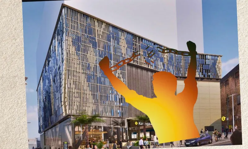 A modern, glass-fronted building with people walking outside. In the foreground, an orange silhouette of a person raises broken chains above their head in a gesture of triumph.