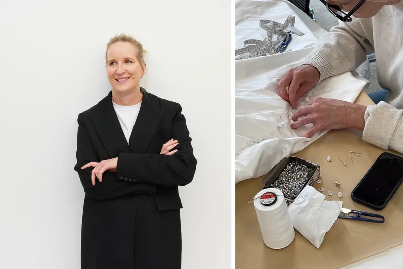 Fashion designer Juliette Hogan, standing and sewing