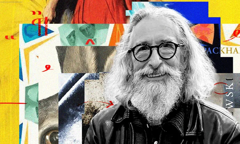 A black and white photo of David Cameron, who has long white hair and beard and is wearing glasses. Behind him is a collage of book covers.