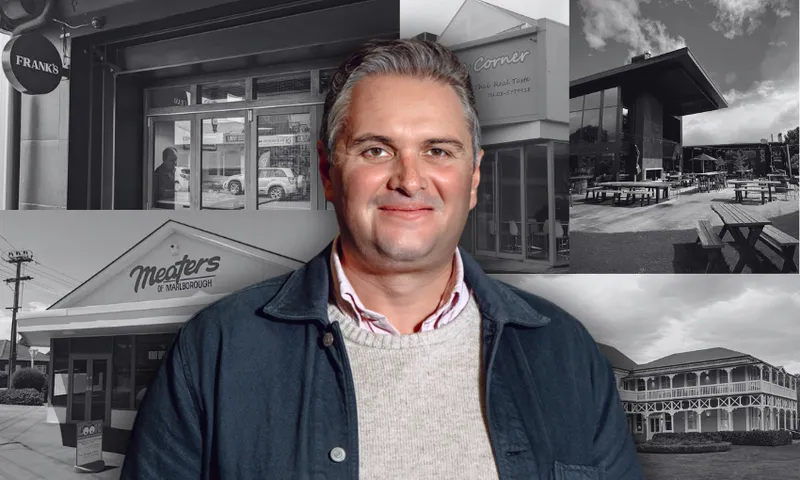 a man in a collared shird, sweater and jacket smiles at the camera. he has short hair and dark eyebrows. in the background, a black and white collage of restaurant frontages