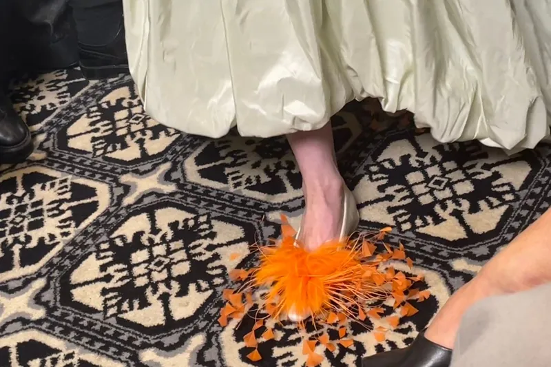 Feathered footwear and taffeta silk on the runway at Claudia Li