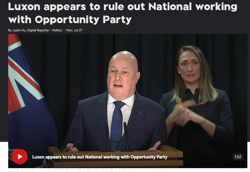 A man in a suit speaks at a podium with a New Zealand flag behind him; a woman beside him is signing in New Zealand Sign Language. Text above reads, “Luxon appears to rule out National working with Opportunity Party.”.