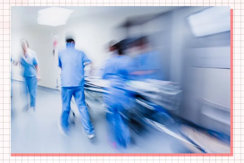 Nurses and doctors rush through a busy hospital