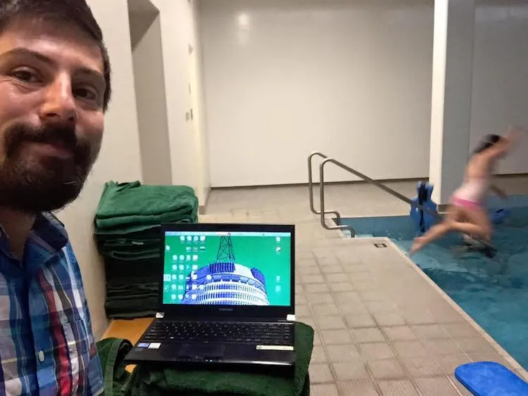 Working hard at his towel-desk, at the parliamentary swimming pool