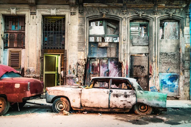 Old damaged vintage Car on the street of old Havana, Cuba