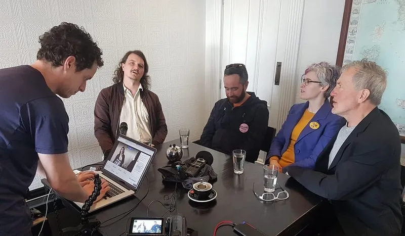 ALEX BRAAE, LEFT, CONOR HILL, JENNY CONDIE, AND NORBERT HAUSBERG GET READY TO DEBATE