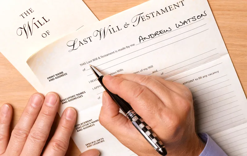 Mature man writing his will