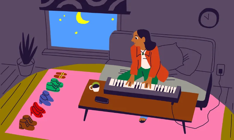 A person plays a keyboard on a coffee table at night. They are sitting on a couch with a moonlit window behind them. Various colorful socks and slippers are lined up on a pink rug, and a cup sits on the table.