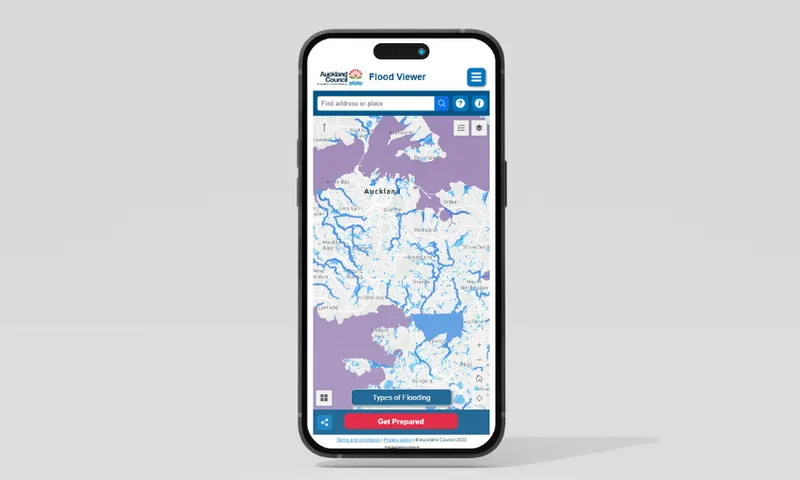 A smartphone displaying the Auckland Council's Flood Viewer map. The map shows highlighted flood-prone areas in purple and white. The screen includes search options and buttons for types of flooding and preparedness.