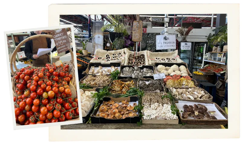 A farmers market stall displays a vibrant variety of fresh mushrooms arranged in baskets and crates, with a smaller inset photo showing a basket of cherry tomatoes held by a vendor.