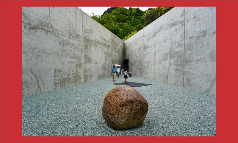 A large round stone sits on gravel in a minimalist concrete courtyard. In the background, a group of people walk towards an opening framed by high concrete walls, with trees visible beyond. The image has a red border.