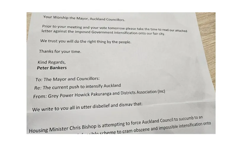 A close-up photo of a printed letter addressed to the Mayor and Auckland Councillors, discussing concerns about government intensification policies in Auckland. The letter is signed by Peter Bankers.