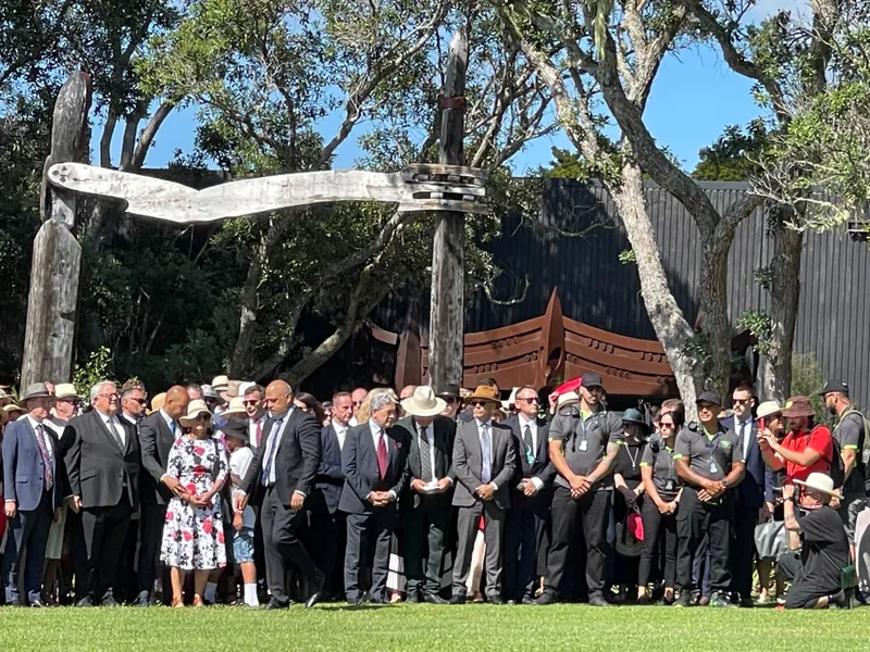 group of politicians mostly in suits gathered on treaty grounds