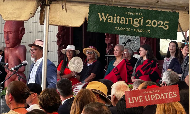 Green's Teanau Tuiono speaking with co-leaders Marama Davidson and Chlöe Swarbrick behind.