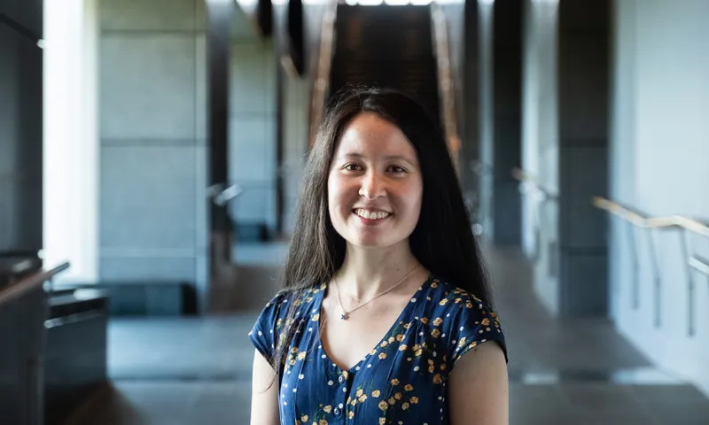 A photo of a young woman called Grace Gessin who is editor of new book called Between Dreams about Asian identities in Aotearoa.