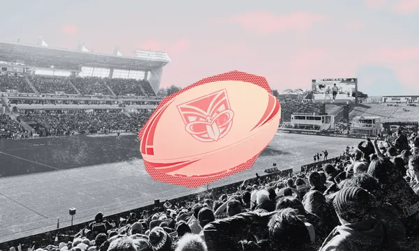 A rugby stadium filled with fans in black and white, with a large, colourful rugby ball featuring a stylised face logo digitally added to the centre.