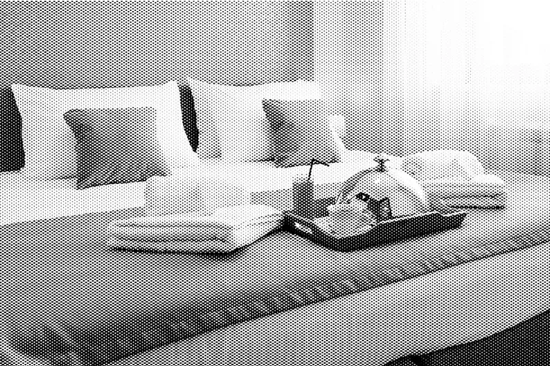 A bed in a hotel room