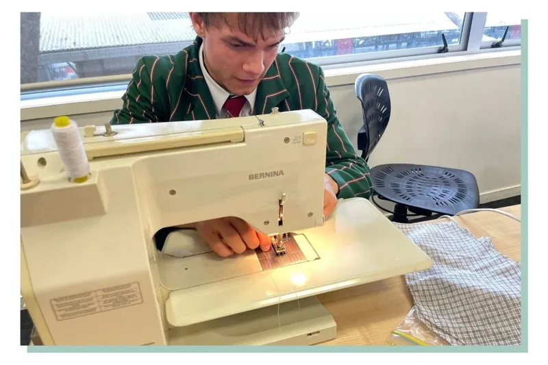 Joseph works at a sewing machine