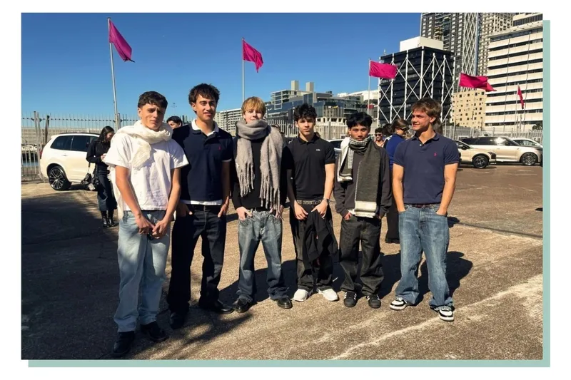 The sewing club wait outside Shed 10 during New Zealand Fashion Week
