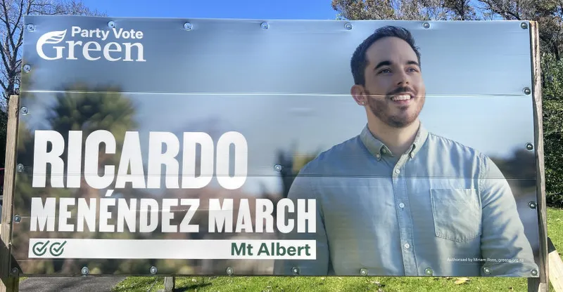A campaign billboard for the Green Party featuring Ricardo Menéndez March, smiling and standing outdoors. The text reads “Party Vote Green” and “Mt Albert.”.