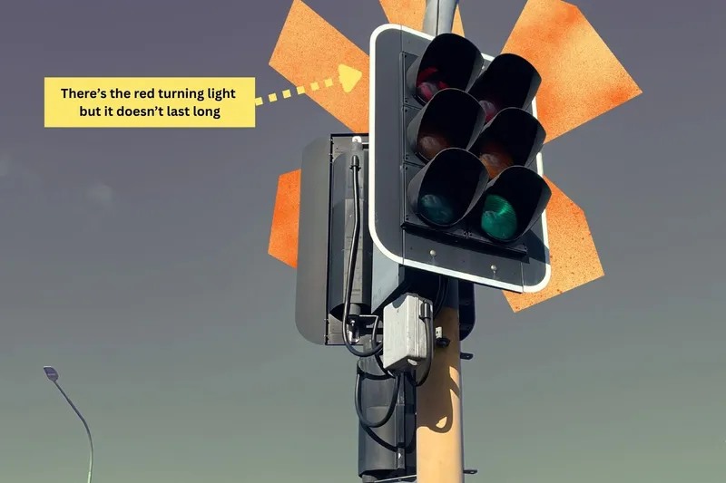 Traffic lights with a red turning arrow.