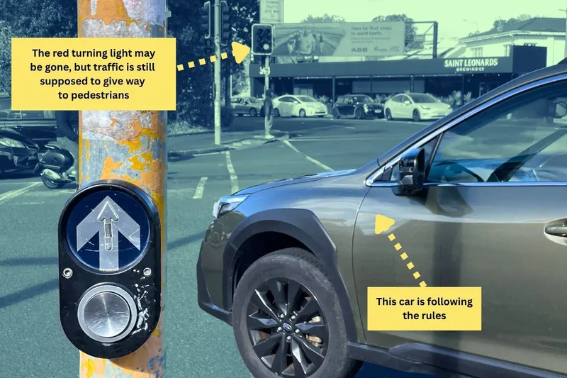 A car turns the left corner at the intersection.